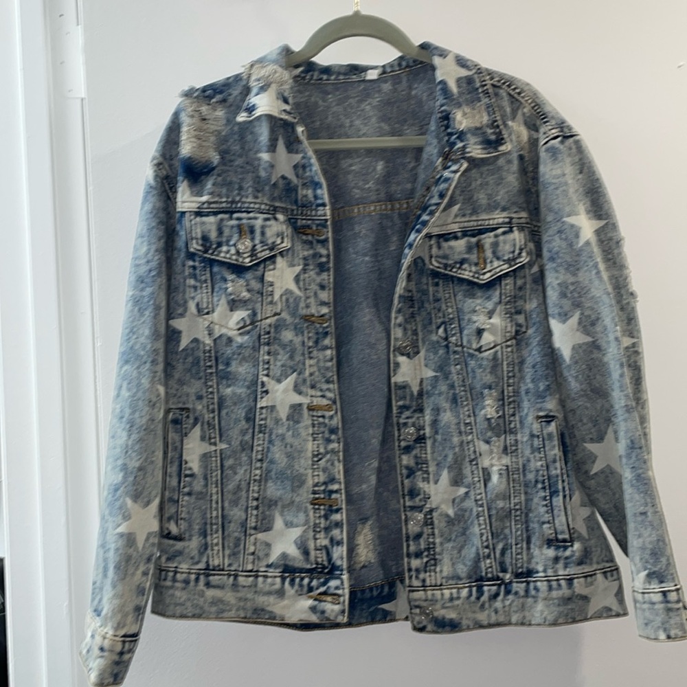 Distressed denim jacket with stars and jewels